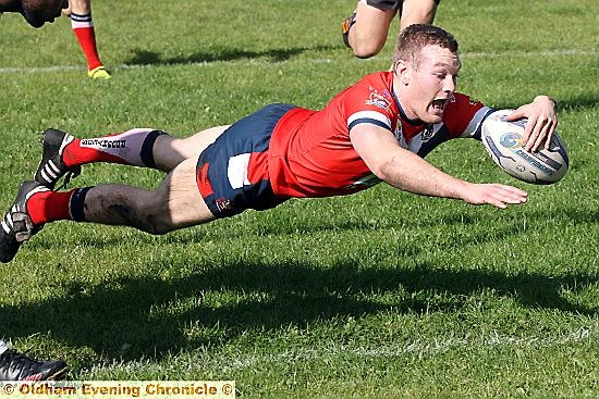 Richard Lepori scores a try for Oldham.