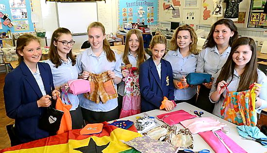 Textiles pupils with some of the dozens of items made for the African children. - (l-r) Roberta Pellowe-Bailey, Ella Shuttleworth, Yasmin Quinlan, Lydia Entwistle, Millie Johnson-Leach, Estelle Adshead, Eleyna Flitcroft, Molly Thornton.