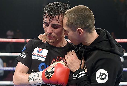 Anthony Crolla is consoled by Scott Quigg after his WBA world lightweight title fight against Darleys Perez was called a draw, at the Manchester Arena. 