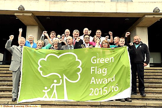 CONGRATULATIONS . . . (front, centre left) Glenn Dale, head of parks and gardens, the Mayor of Oldham, Councillor Ateeque Ur-Rehman, and Mayoress, Councillor Yasmin Toor, celebrate the Green Flag success with council staff