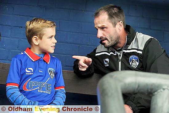 FOUND! Freddie Hulley with manager Darren Kelly in the dugout yesterday. 
