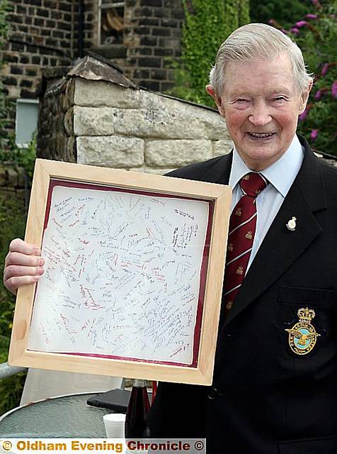 DAMBUSTER squadron member Cyril Gosling, was presented with a framed copy of the famous tea towel signed by all squadron members