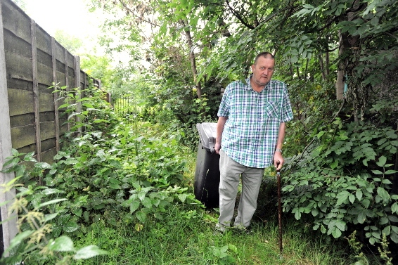 Ian Graham drags his bin through the jungle