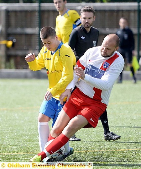 Royton's Jake Coe (left) is tackled by Andrew Pheby