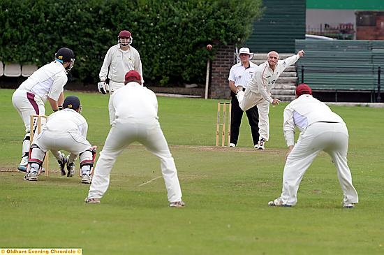 GOLDEN OLDIE . . . the remarkable Mel Whittle has men round the bat as Crompton pressurise Werneth before the intervention of rain. Picture by Tim Bradley.