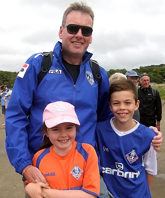 FAR-FLUNG FANS: David Walls, pictured with daughter Inara (seven) and 11-year-old
son Lewis at Morecambe Bay.