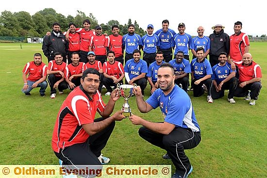 UP FOR GRABS . . . Pro League skipper Qaisar Abbas (left) and ONQ captain Gharib Razak, watched by their team-mates, get their hands on the trophy before the final at Hollinwood.