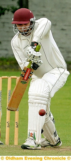 REARGUARD ACTION . . . Ian Dronsfield on his way to a brave 46 against Crompton on Sunday.