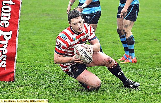 TRY . . . Jack Holmes put Oldham in front