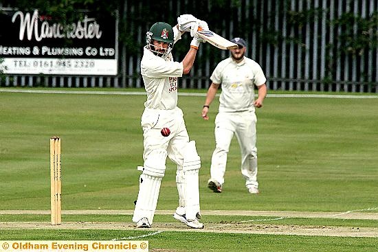 STANDING TALL . . . Crompton professional Josh Tolley gets on his toes during his knock of 65 for Crompton against Heyside. 