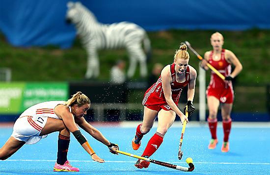 GO FOR IT . . . Nicola White (right) battles for posssession with Netherland's Maartje Paumen during yesterday’s final.