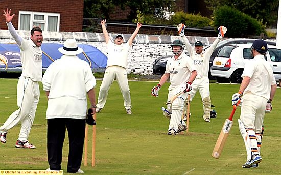 NOT THIS TIME . . . Moorside’s Rick Harrington survives a confident appeal from Saddleworth’s Dave Roberts. 