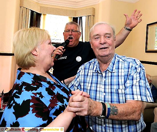 SING-SONG . . . Janice Harrison and Chris Makinson (front) are entertained by Tesco worker Ron Rennie.