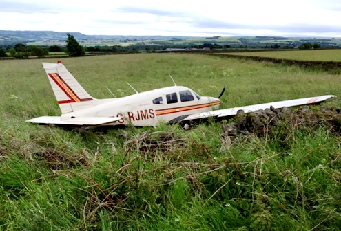 The damaged plane ended up in a field