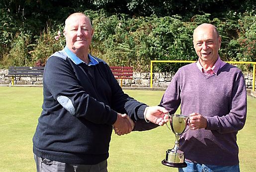 FRANK Cassidy (right) receives the President’s Cup from Veterans’ League vice-chairman Roy Kelly.