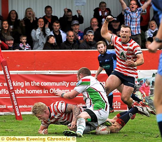 OH YES!: George Tyson dives over for his try.