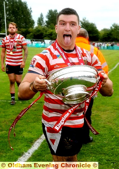 YOU BEAUTY: Liam Thompson celebrates with the silverware.