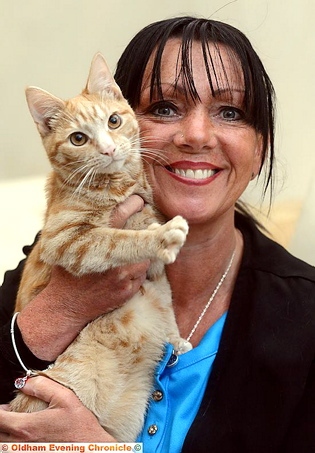 Davina Hanes with cat Peanut.