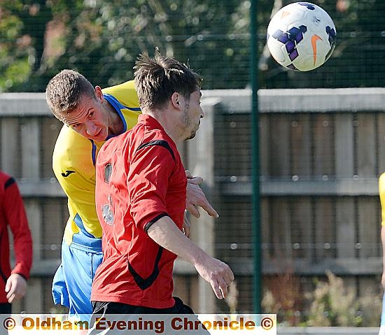 heads I win: Royton Town’s Tom Hughes directs an attempt at the AFC Monton goal.
John Gilder