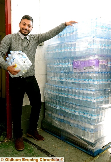 HELPING hand . . . Shaakir Chowdhury with donations ready to be despatched