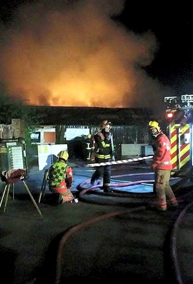 FIREFIGHTERS tackle the blaze at Oldham Sofa Company