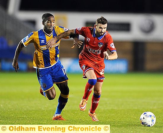 Athletic new man Mark Yeates finds it difficult to make inroads against a determined Shrewsbury outfit.