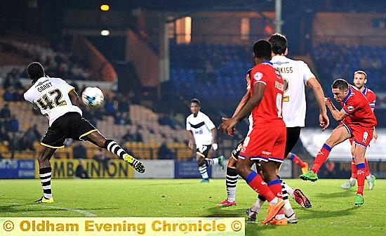 long-range effort: Athletic midfielder Mike Jones attempts to add to his side’s tally in last night’s clash at Port Vale. 
