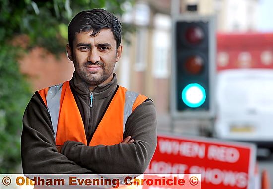 Carwash owner and part-time traffic manager, Azad Ahmed.