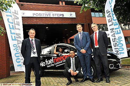 BATTERY power . . . from left, Anthony Sever and, in car, Rina Dabhi, both from Positive Steps; Kashif Ashraf from Oldham Business Leadership Group, Miles Broome from Nissan GB and Phil Behrens from West Way Nissan in Oldham