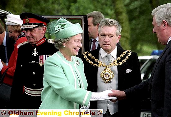 The Mayor, Councillor Norman Bennett, joins the Queen as she shakes hands with Colin Smith, then the council’s chief executive