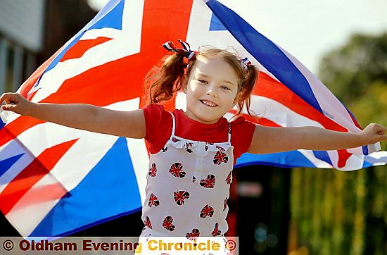 FLYING the flag . . . Caitlin Clarke-Gledhill joined fellow pupils and staff at East Crompton St George’s Primary School in Shaw as they donned red, white and blue in recognition of the Queen officially becoming the longest-serving monarch today. 