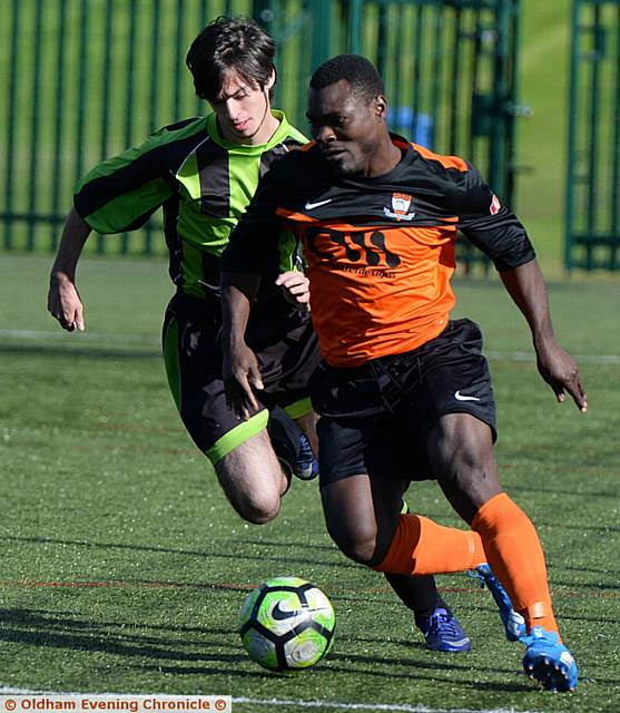 ON THE CHARGE . . . Samuel Opara makes his presence felt for AFC Oldham