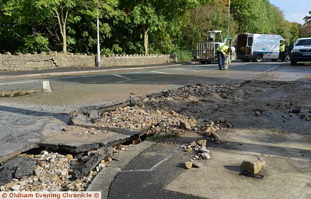 Damage caused by burst water main on Manchester Road, Greenfield at the junction with Dacres Road.