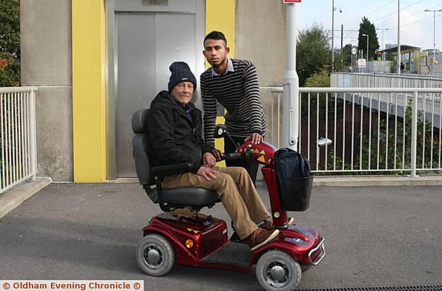 Tony Wrigglesworth, aged 65, was stranded on the platform at, Freehold, Metrolink station, Oldham, when the lifts went out of order and could not get down the steps on his mobility scooter. Tony was on his way to a karaoke night at the Dog Inn, Chadderton. Picture shows, L/R, Tony Wrigglesworth, Farek Rahman, aged 20, who came to to the aid of Tony who suffers from chronic obstructive pulmonary disease.
