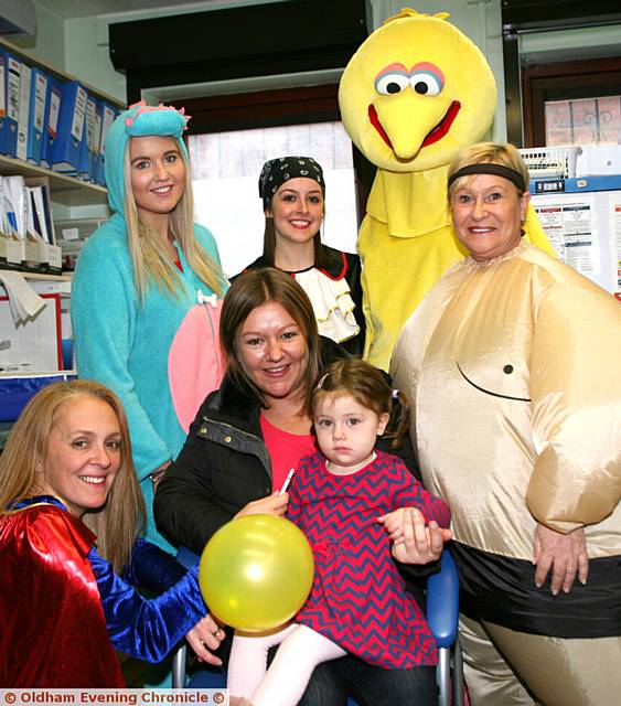 ALL dressed up, from the left, Dianne Davis, practice nurse, Holly Whitehead, Lexi Ogden, both receptionists, Olivia Smith, health care assistant, Gill Tandy, medical practice administrator, with Kim Dean and her daughter Lacy Millership (aged 2)