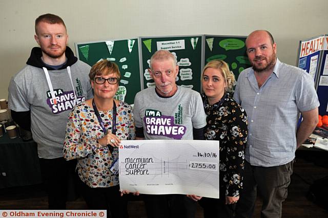 BERNARD Exton presents a cheque for £2,755 to Macmillan after he and Todd Bowers (left) had their heads shaved. Also pictured are Donna Dawson and Jade Hughes (Macmillan 1 to 1) and Steve Lawton (Macmillan benefits advisor)