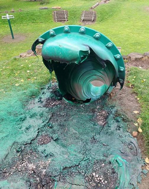 DESTROYED . . . The children's play slide in Dogford Park targeted by arsonists