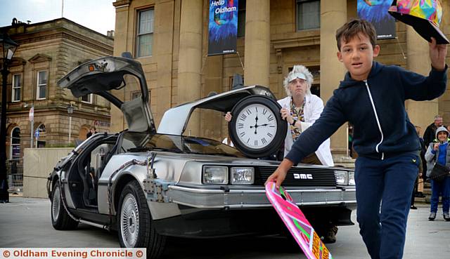 Odeon Oldham Celebration of the Silver Screen event. Marley Shirley (9) takes a ride on a hover board as he meets Doc Brown and the famous Delorean time machine from Back to the Future. 