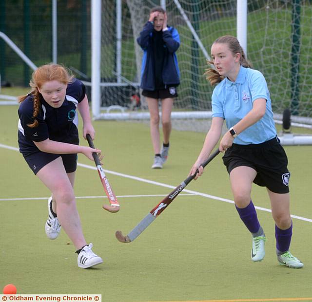 HE Years Seven and Eight hockey competition sees Chloe Major (Oasis Academy, left) challenging Olivia Copple (Newman College)