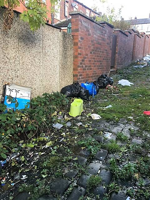 Fresh bags of rubbish were dumped in the alleyway a few days ago