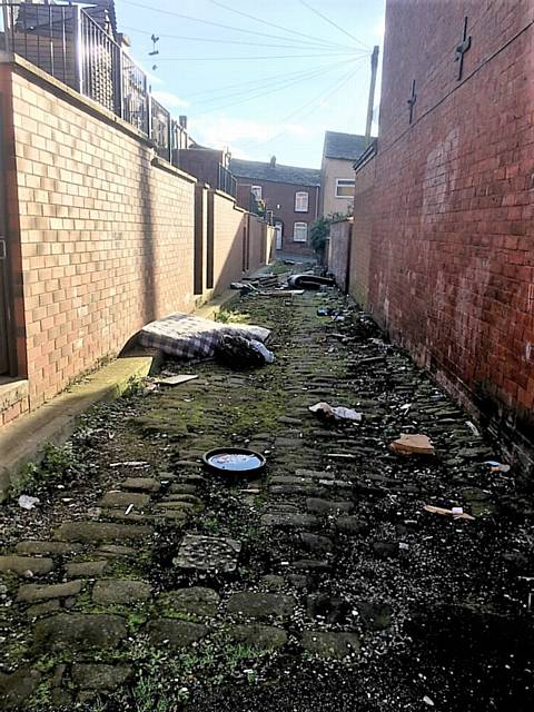A mattress was among household waste dumped in a Mansfield Road alleyway