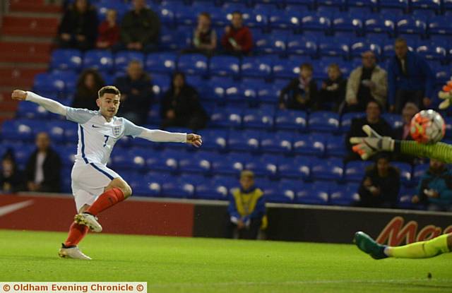 CRISP FINISH . . . England's first goal is scored by Patrick Roberts.
