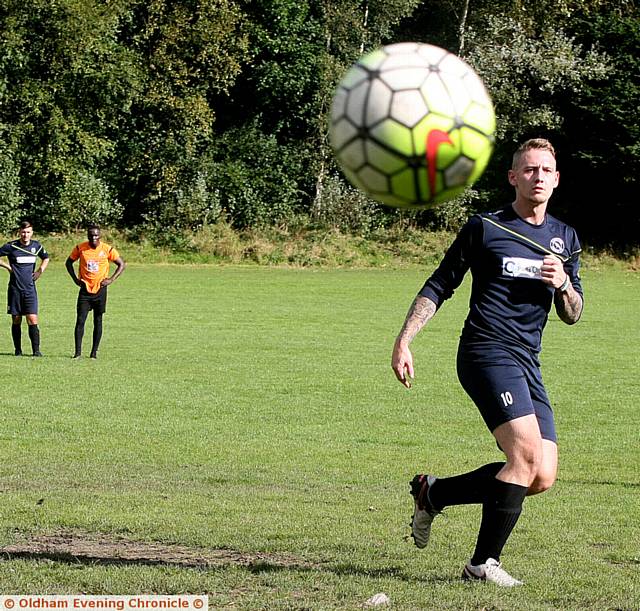 Carrion Crow V Casim of Manchester, match played at Snipe Clough, Oldham. Pic shows, Callum Beckett, playing for Carrion Crow, (blue strip), taking a penalty, that was saved by the Casim goalkeeper.. 