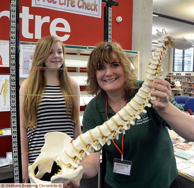 FLASHBACK to last year's event where Annabel Hartley (13) has a free life check by chiropractor Lisa Buckley
