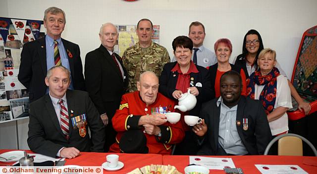 Tesco Failsworth hold an afternoon tea to thank former servicemen. Pictured is Chelsea Pensioner Denis Shiels, Rose Knipe from Tesco and triple amputee Lamin Maneh

