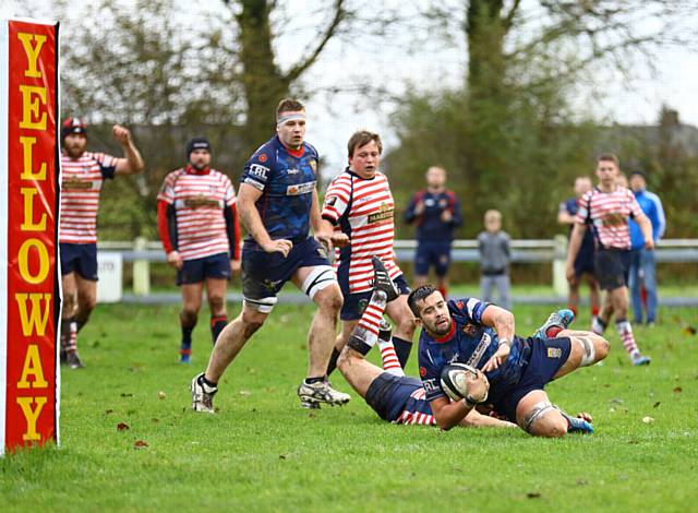 TRY TIME: Josh Watson dives over the line against Aldwinians. PICTURES by TIM ABRAM