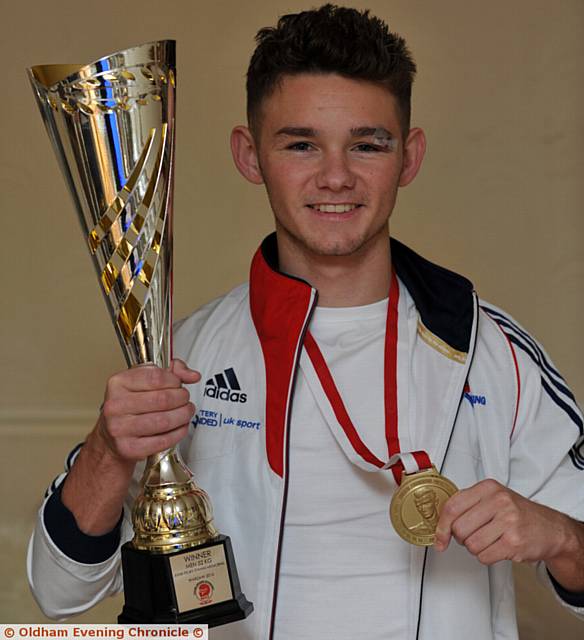 WILL Cawley shows off his medal and trophy after victory in Poland