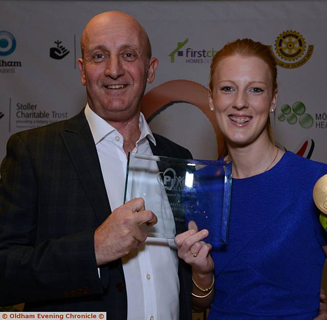 GOLDEN MOMENT . . . Special Recognition winner Nicola White shows off her trophy and her prized Olympic gold medal with Oldham Evening Chronicle managing editor David Whaley. 