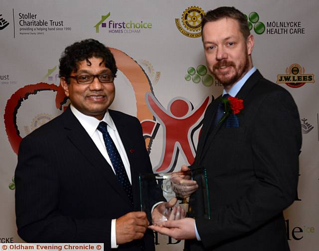 GEEK TREAT . . . Love Where You Live winner Andy Powell, of Hack Oldham with presenter Councillor Abdul Jabbar.

