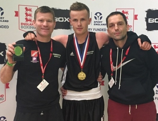 WELL DONE, CHAMP! . . . Andy Stafford is flanked by delighted Chadderton head coach 